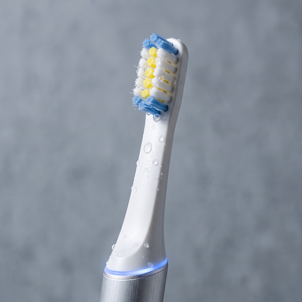 PulseONE sonic toothbrush in Platinum, brush head close up