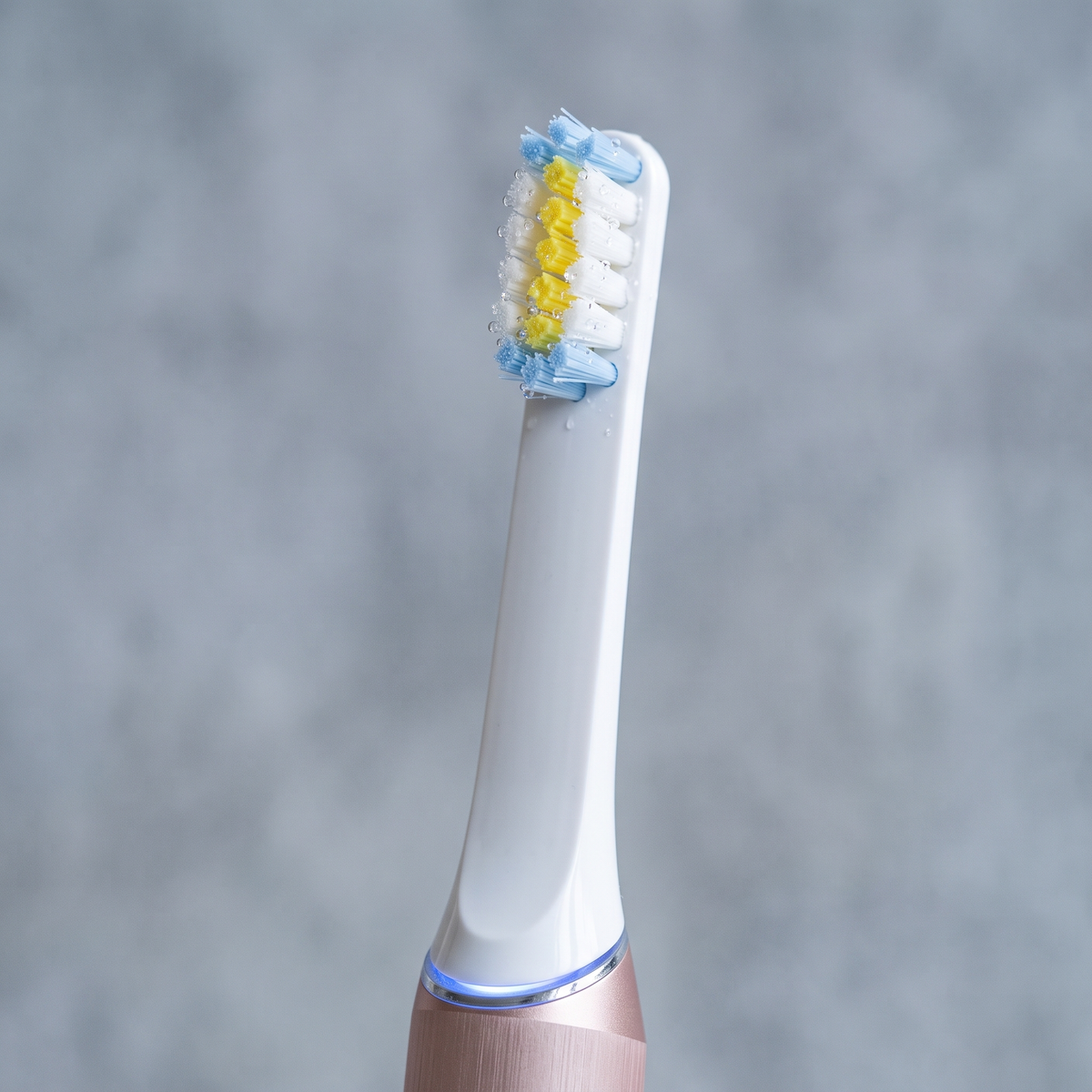 PulseONE sonic toothbrush in Rose, brush head close up