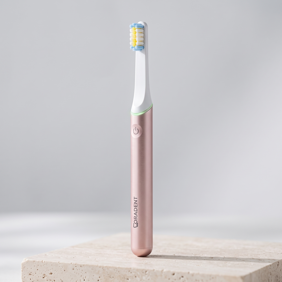 PulseONE sonic toothbrush in Rose, three quarter view with the LED ring lit