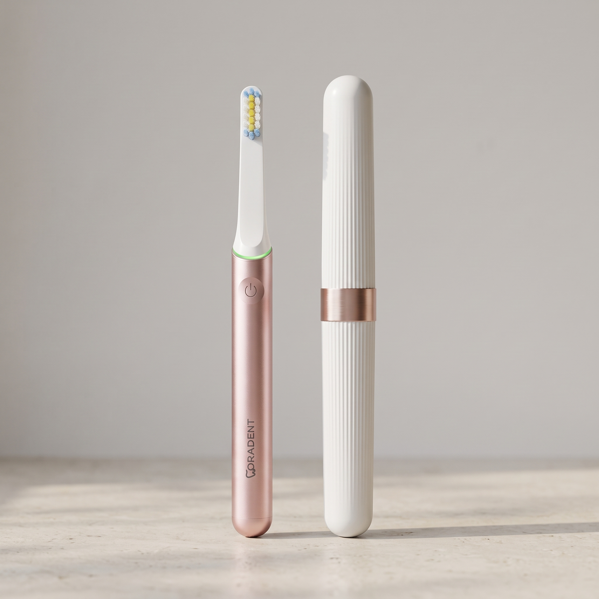 PulseONE sonic toothbrush in Rose, beside its travel case