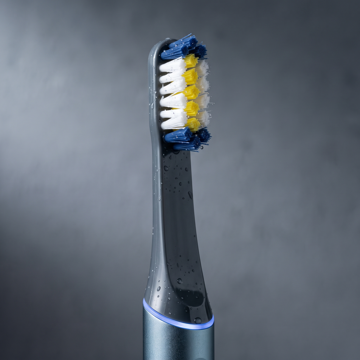 PulseONE sonic toothbrush in Graphite, brush head close up