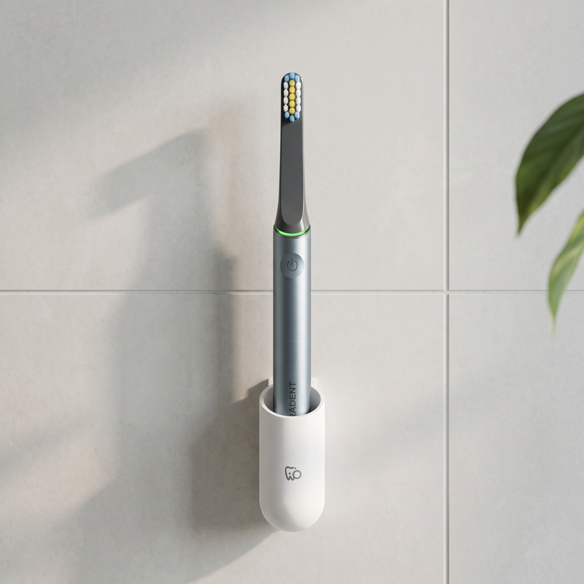 PulseONE sonic toothbrush in Graphite, in the WallMount on a bathroom wall